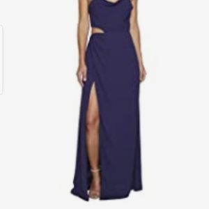 Purple sleeveless cocktail dress thigh-high split.